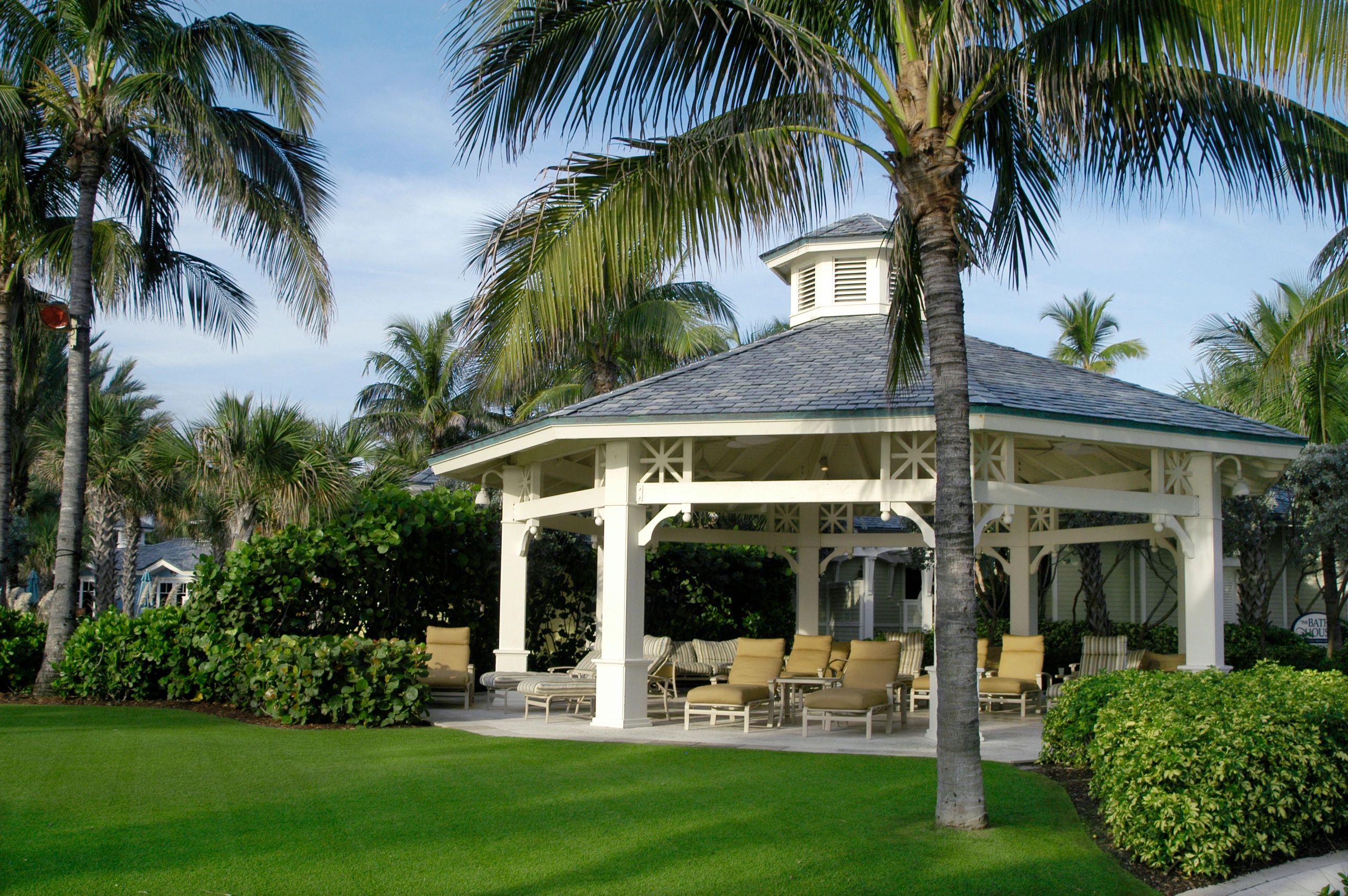 Gazebo seating area in a landscaped outdoor setting